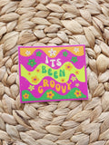 Colorful card with 'It's Been Groovy' text on a woven mat