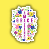 Sticker with floral design and text 'I AM GRACIZING' on a yellow background