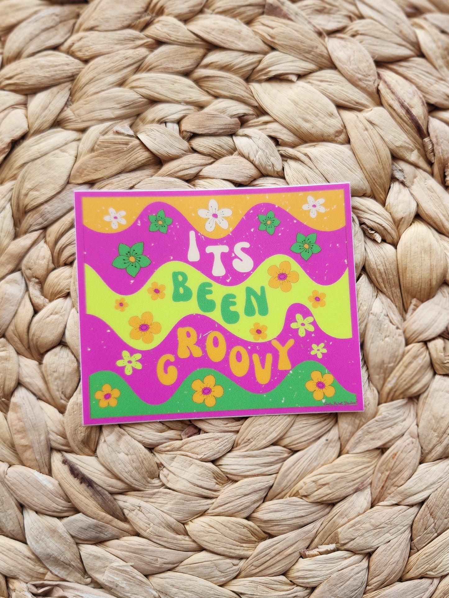 Colorful card with 'It's Been Groovy' text on a woven mat