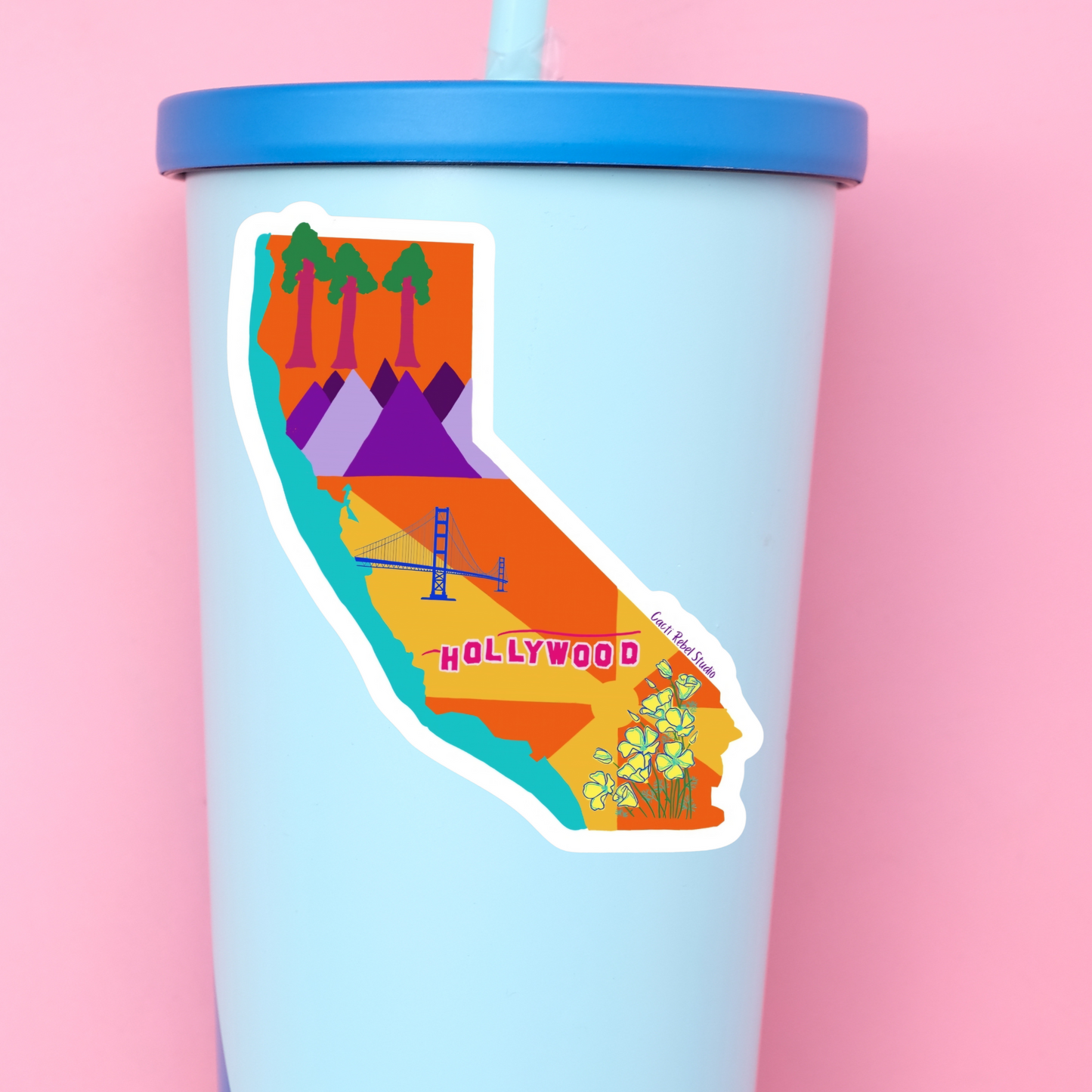 A blue water bottle with a vinyl sticker of a map highlighting the state of California with the 'Hollywood' sign, depicted in vibrant colors against a pink background.