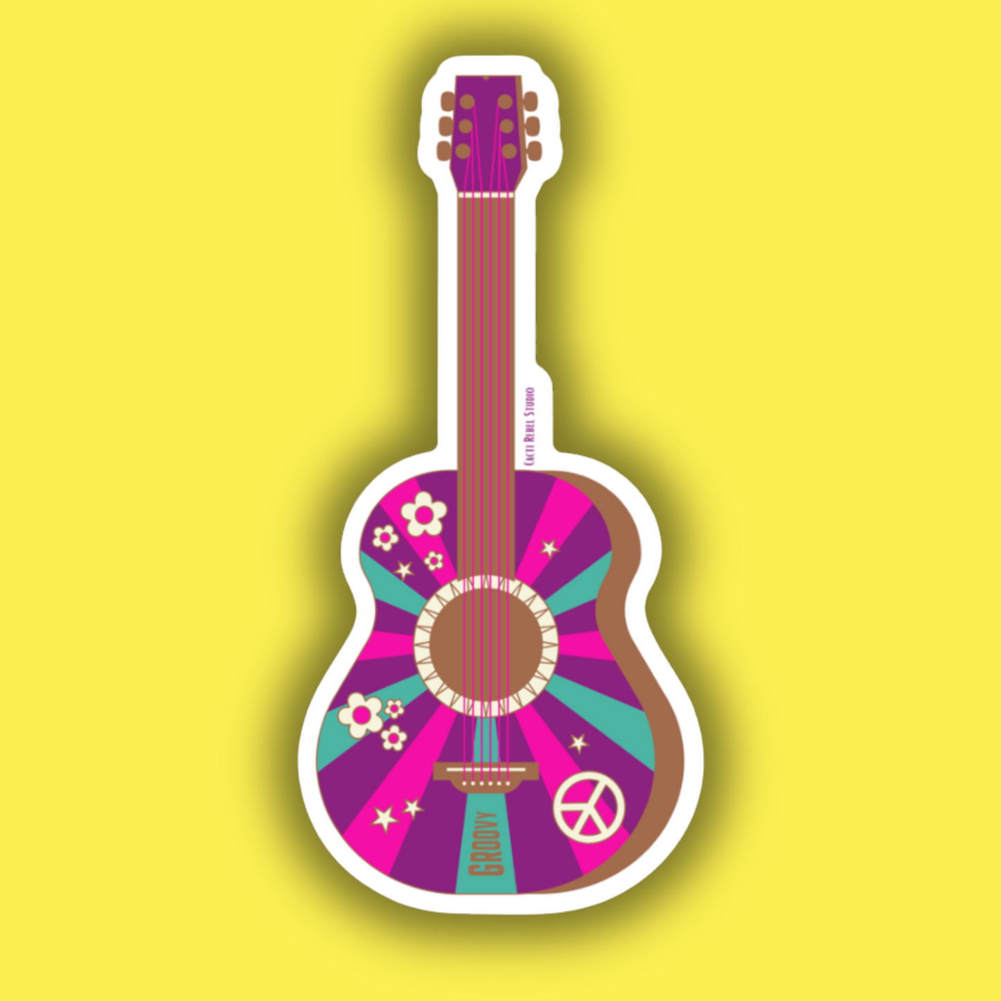 Colorful guitar-shaped object on a yellow background