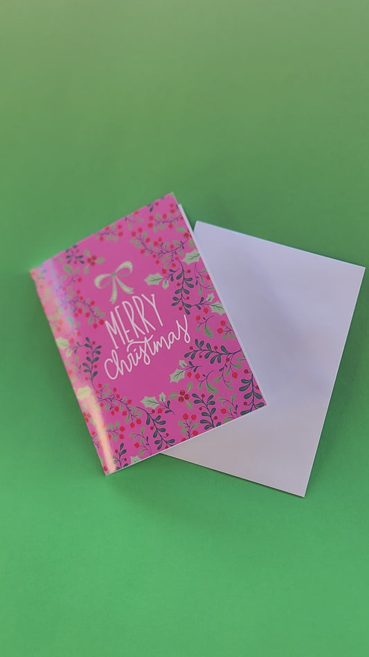 Pink Merry Christmas Greeting Card with Decorative Holly